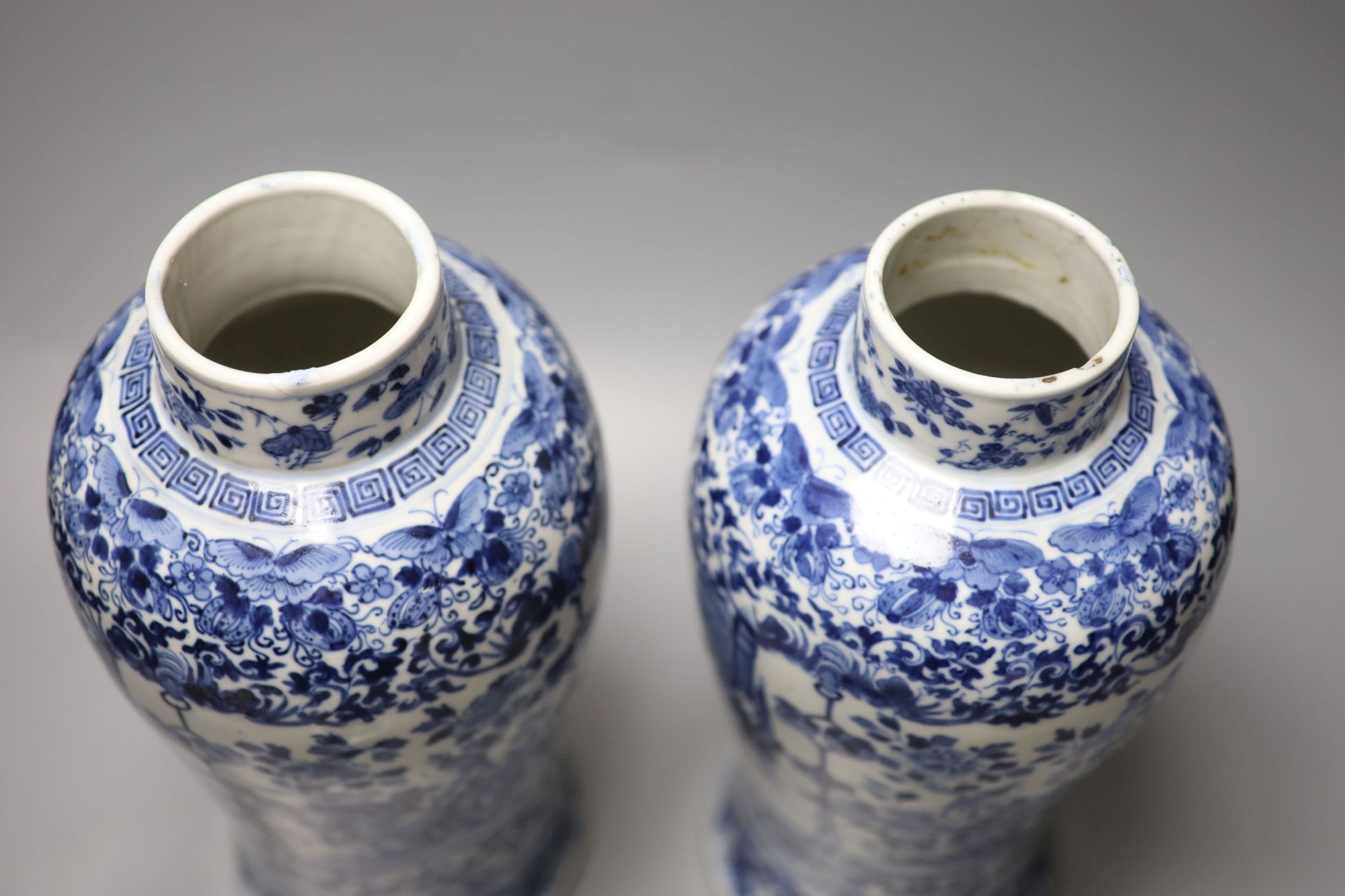 A pair of Chinese blue and white baluster vases and covers, Kangxi marks, late 19th century, 39.5cm high